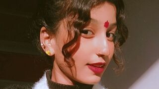 Dia Quin dark brown eyes closeup