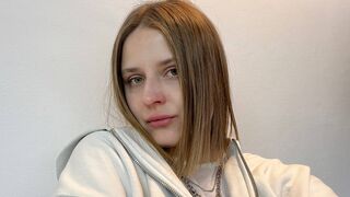 Rebecca Bellore blonde green eyes video chat
