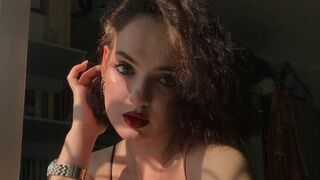 Rina Loren dark brown eyes closeup